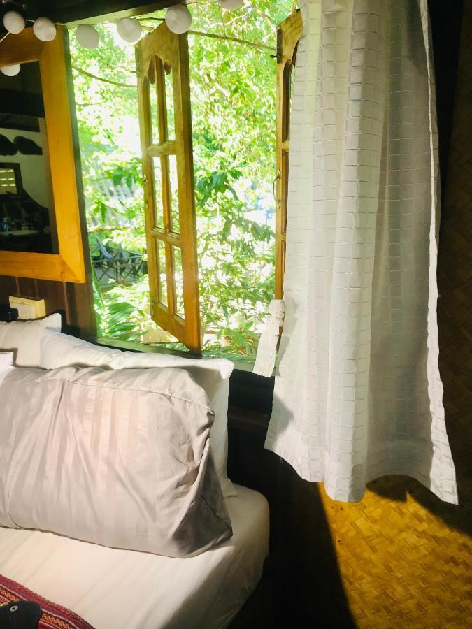 Bambu Huts Hotel บ้านใต้ ภายนอก รูปภาพ